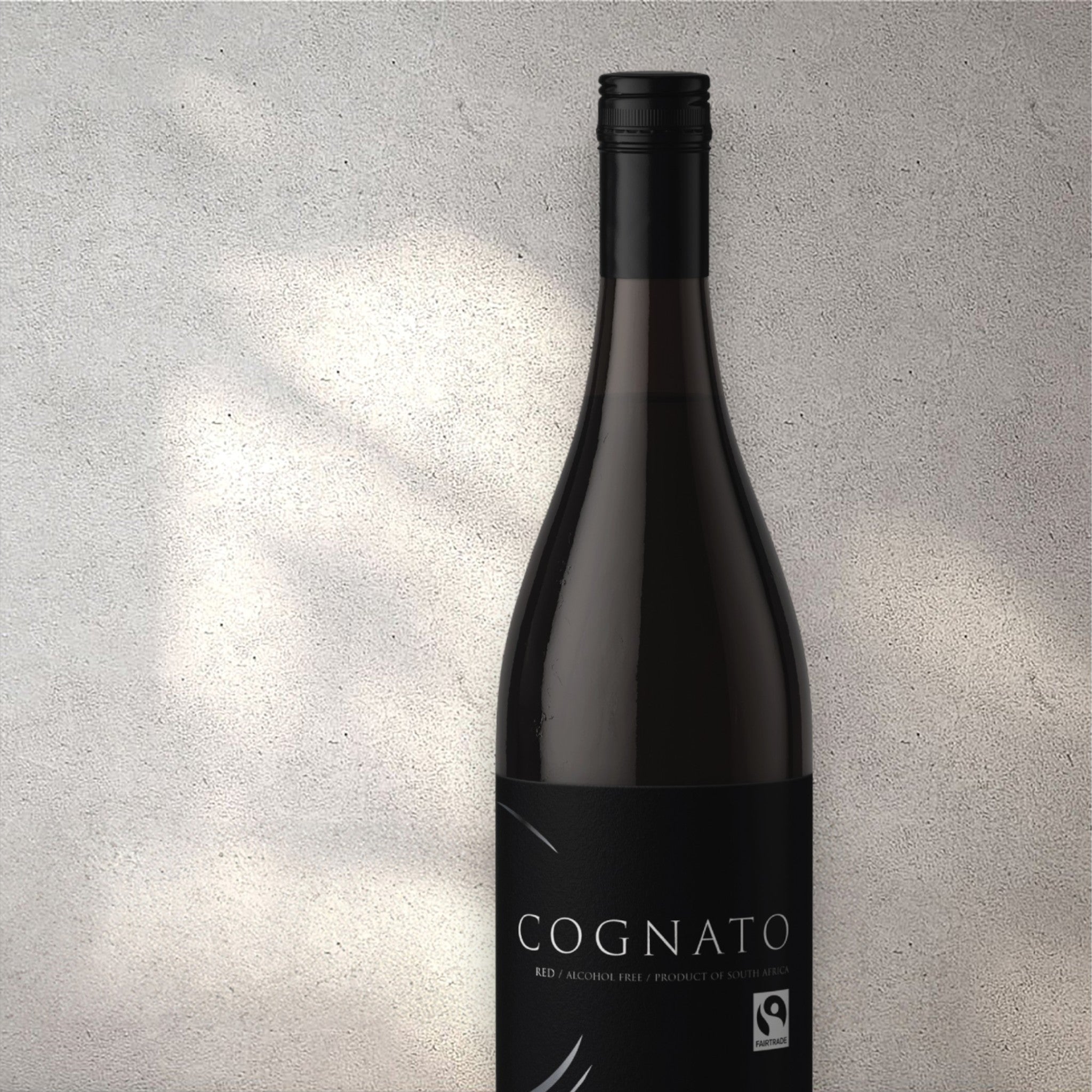 Closeup of a Cognato Cabernet Sauvignon alcohol-free red wine bottle with a detailed label, set against a textured concrete wall, highlighting its refined design and deep red color.